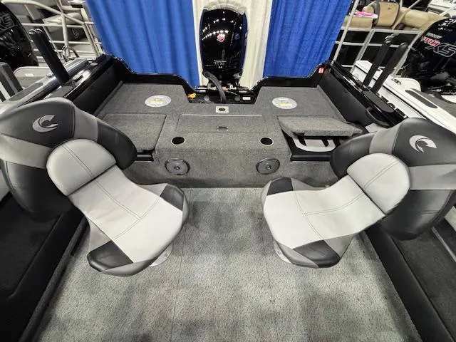 Slide: The Image of 2025 Crestliner 1850 Super Hawk WT JS interior with two seats and storage compartments. - 21