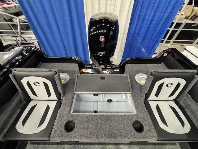 Slide: The Image of 2025 Crestliner 1850 Super Hawk WT JS boat interior with seating and motor. - 23
