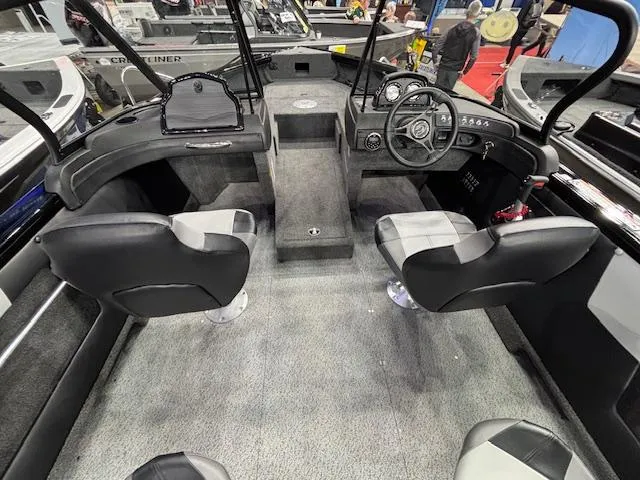 Slide: The Image of 2025 Crestliner 1850 Super Hawk WT JS boat interior with four seats and steering console. - 4