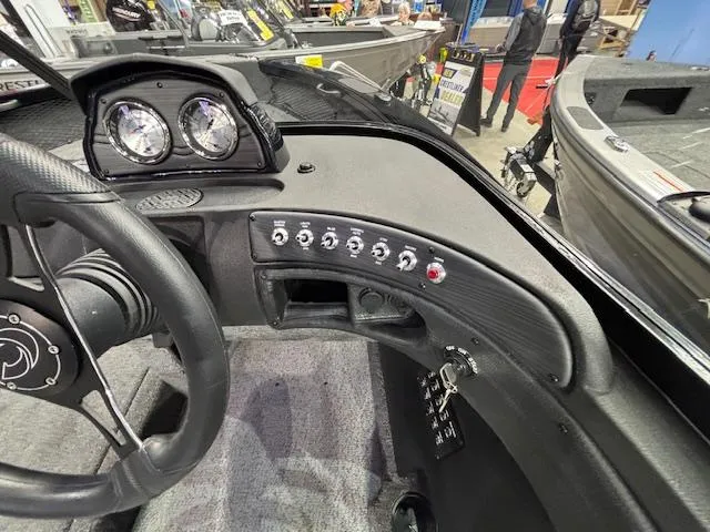 Slide: The Image of Dashboard of 2025 Crestliner 1850 Super Hawk WT JS boat with control panel and gauges. - 6