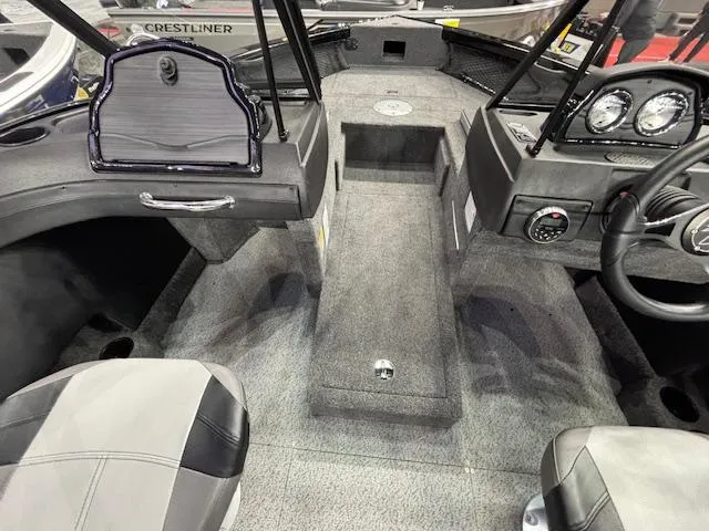 Slide: The Image of Interior of 2025 Crestliner 1850 Super Hawk WT JS boat, featuring seating and dashboard. - 8