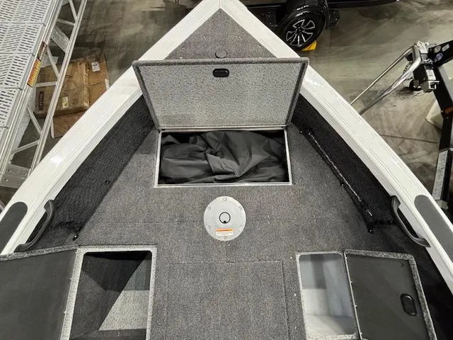 Slide: The Image of 2025 Crestliner 1750 Super Hawk WT JS boat interior with open storage compartments. - 15