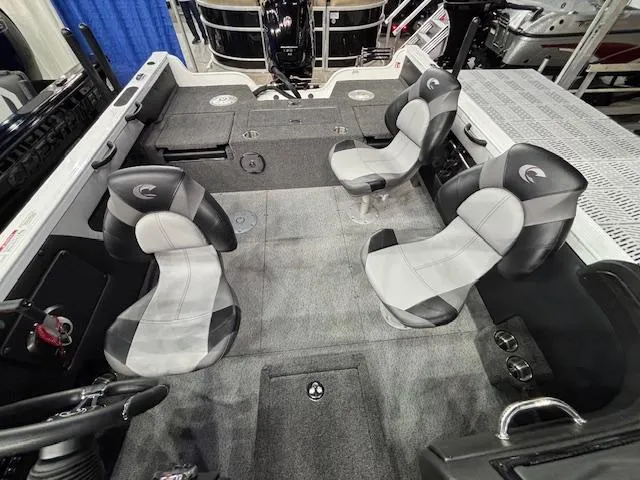 Slide: The Image of 2025 Crestliner 1750 Super Hawk WT JS interior with four seats and carpeted flooring. - 18