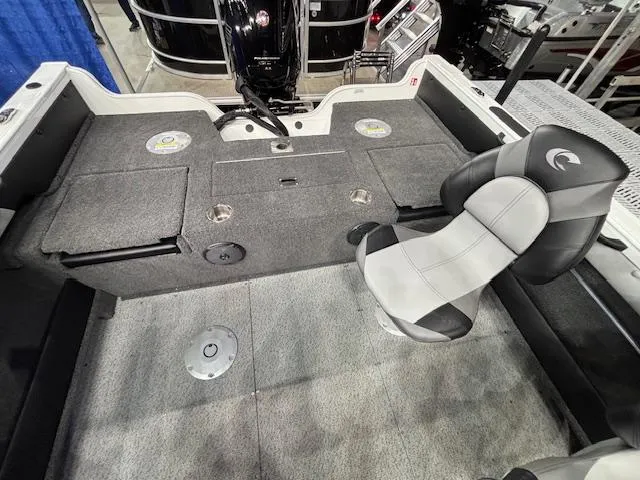 Slide: The Image of 2025 Crestliner 1750 Super Hawk WT JS boat interior with seating and storage compartments. - 19