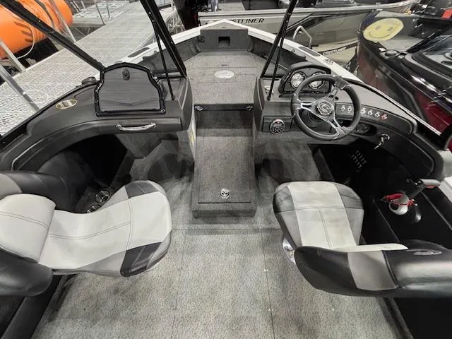 Slide: The Image of 2025 Crestliner 1750 Super Hawk WT JS interior with dual seats and steering console. - 5