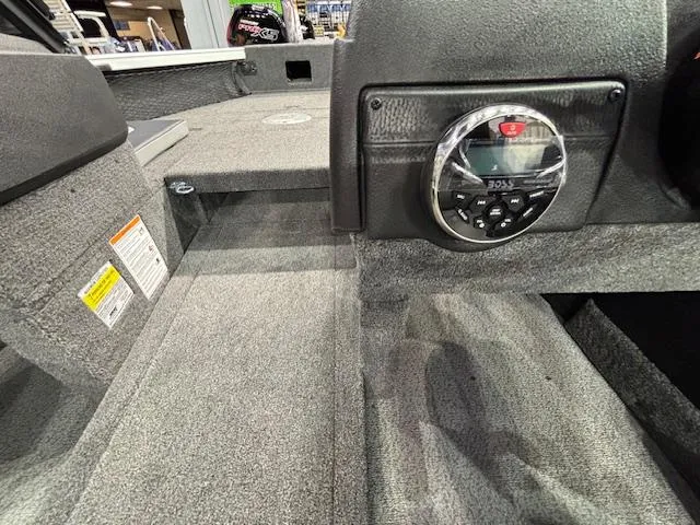 Slide: The Image of 2025 Crestliner 1750 Super Hawk WT JS interior with carpeted flooring and control panel. - 7