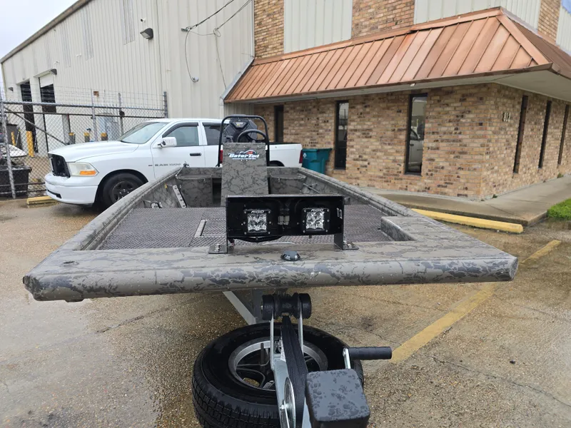 Slide: The Image of 2022 Gator Tail 1860 Extreme CC boat on trailer, parked outside industrial building. - 10