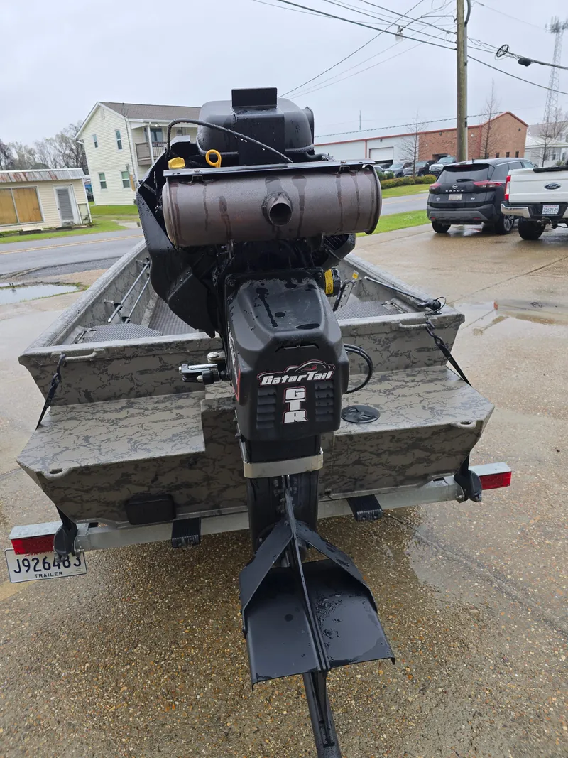 Slide: The Image of 2022 Gator Tail 1860 Extreme CC boat with motor, parked on a trailer. - 4