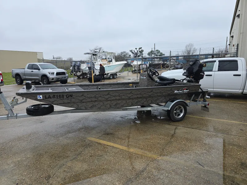 Slide: The Image of 2022 Gator Tail 1860 Extreme CC boat on trailer in parking lot. - 6