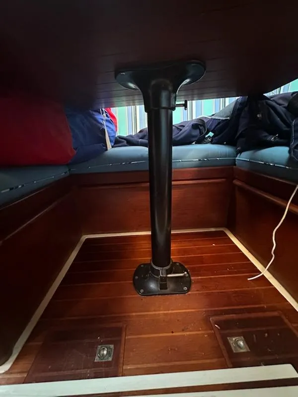 Slide: The Image of Interior of 1985 Ericson 30 Plus sailboat with wooden flooring and seating. - 27