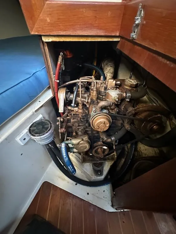 Slide: The Image of 1985 Ericson 30 Plus sailboat engine compartment with visible mechanical components. - 28