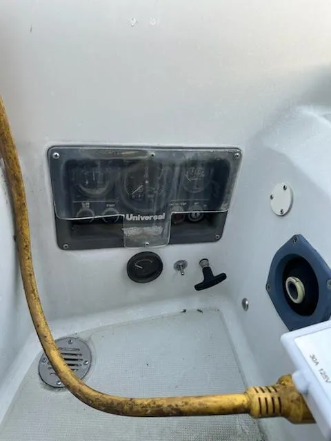 Slide: The Image of Control panel of a 1985 Ericson 30 Plus sailboat with Universal engine gauges. - 34
