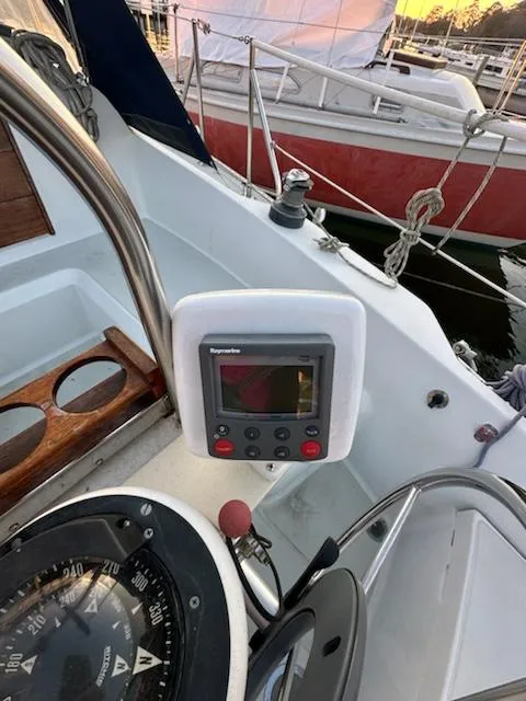 Slide: The Image of Cockpit of 1985 Ericson 30 Plus sailboat with navigation instruments and compass. - 38