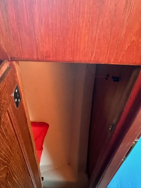 Slide: The Image of Interior view of 1985 Ericson 30 Plus sailboat with wooden cabinetry. - 7