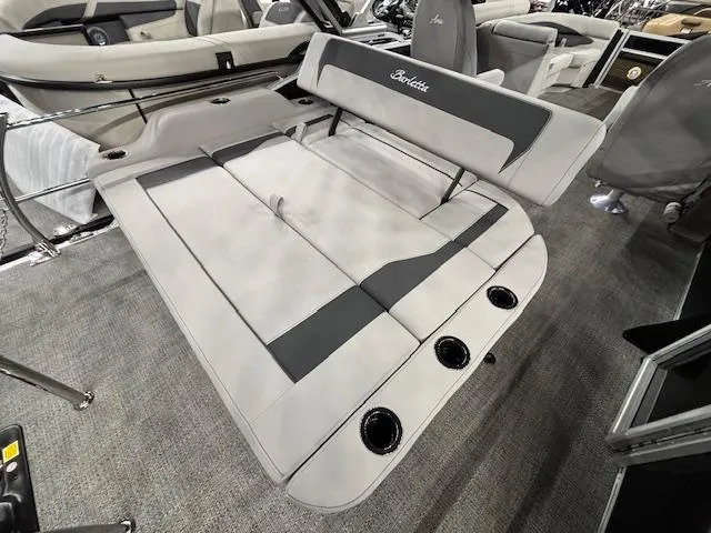 Slide: The Image of 2025 Barletta ARIA 22UC boat interior with gray seating and cup holders. - 12