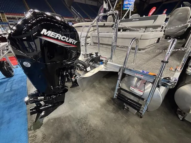 Slide: The Image of 2025 Barletta ARIA 22UC pontoon boat with Mercury outboard motor at a boat show. - 13