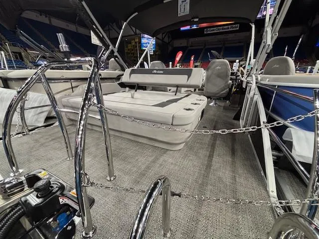 Slide: The Image of 2025 Barletta ARIA 22UC pontoon boat interior with seating and chrome railings. - 15