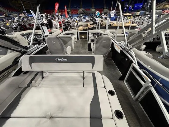 Slide: The Image of 2025 Barletta ARIA 22UC pontoon boat interior at a boat show display. - 17
