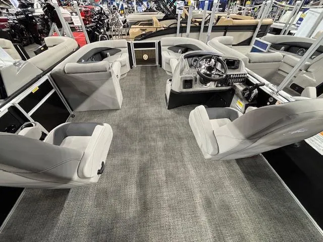 Slide: The Image of 2025 Barletta ARIA 22UC pontoon boat interior with modern seating and steering console. - 18
