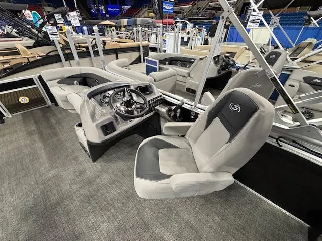 Slide: The Image of 2025 Barletta ARIA 22UC boat interior with modern helm and comfortable seating. - 19