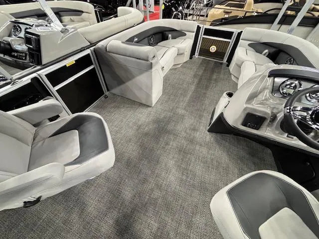 Slide: The Image of 2025 Barletta ARIA 22UC pontoon boat interior with plush seating and modern dashboard. - 23