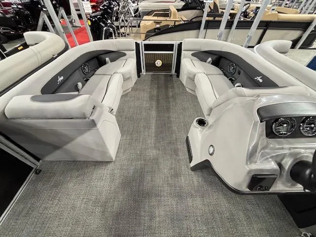 Slide: The Image of 2025 Barletta ARIA 22UC pontoon boat interior with plush seating and modern dashboard. - 24