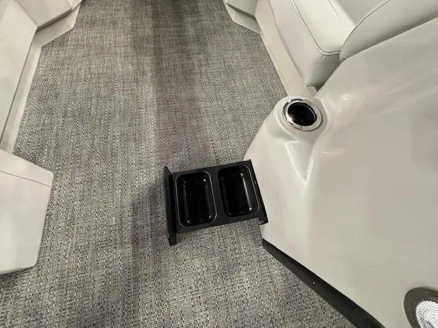 Slide: The Image of 2025 Barletta ARIA 22UC interior with cup holders and gray carpet flooring. - 26
