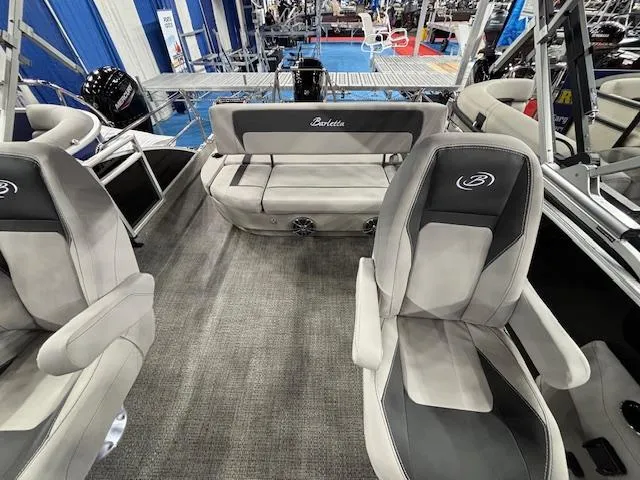 Slide: The Image of 2025 Barletta ARIA 22UC pontoon boat interior with plush seating and modern design. - 7
