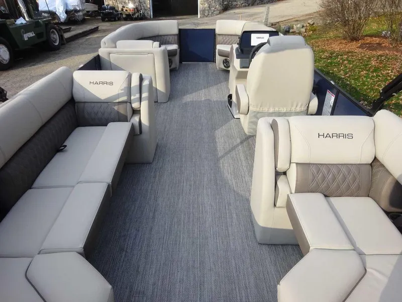 Slide: The Image of 2024 Harris Sunliner 230 pontoon boat interior with luxurious seating and modern design. - 3