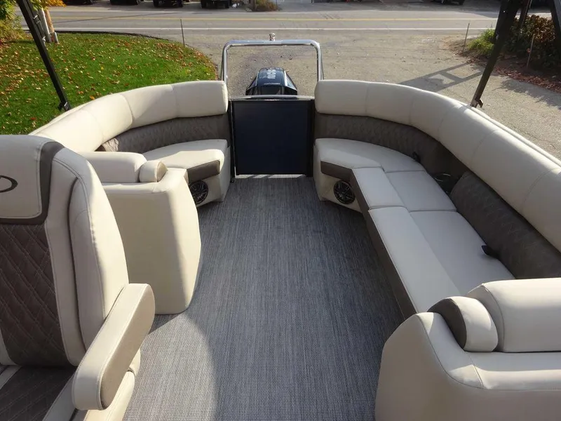 Slide: The Image of 2024 Harris Sunliner 230 pontoon boat interior with plush seating and spacious layout. - 5