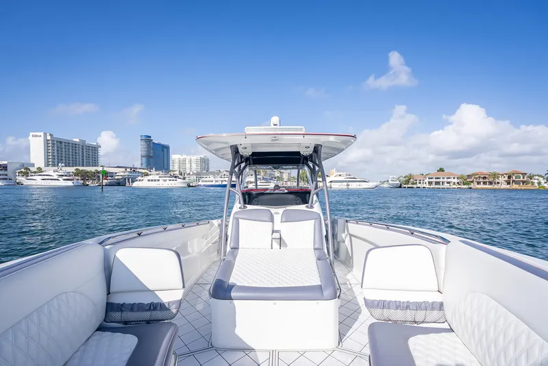 Slide: The Image of 2018 Nor-Tech 390 boat on water with city skyline in background. - 29