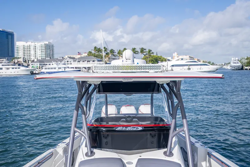 Slide: The Image of 2018 Nor-Tech 390 boat on water with cityscape background. - 30