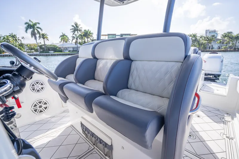 Slide: The Image of 2018 Nor-Tech 390 boat interior with luxurious seating and waterfront view. - 37
