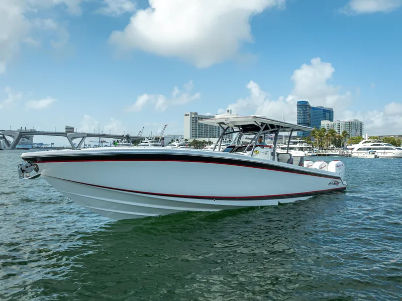 Slide: The Image of 2018 Nor-Tech 390 boat on water with cityscape background. - 4