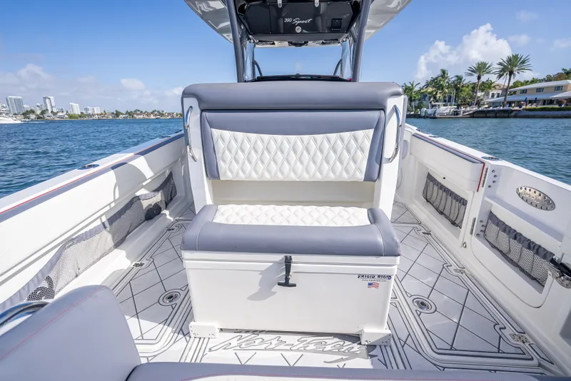Slide: The Image of 2018 Nor-Tech 390 boat interior with luxury seating and scenic waterfront view. - 43