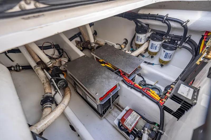 Slide: The Image of Engine compartment of a 2018 Nor-Tech 390 boat, showcasing wiring and components. - 48