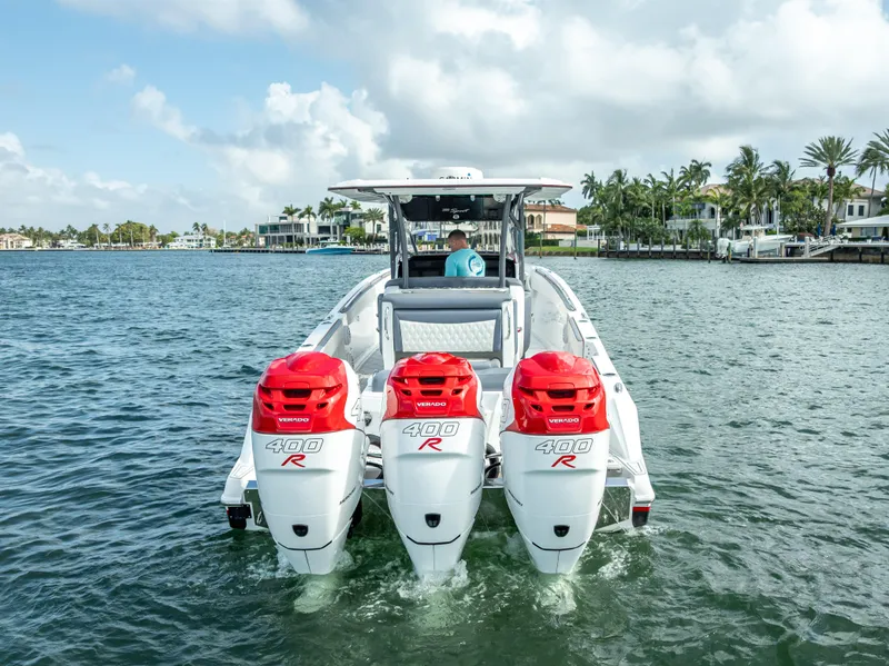 Slide: The Image of 2018 Nor-Tech 390 boat with triple Mercury 400R engines on a sunny day. - 7