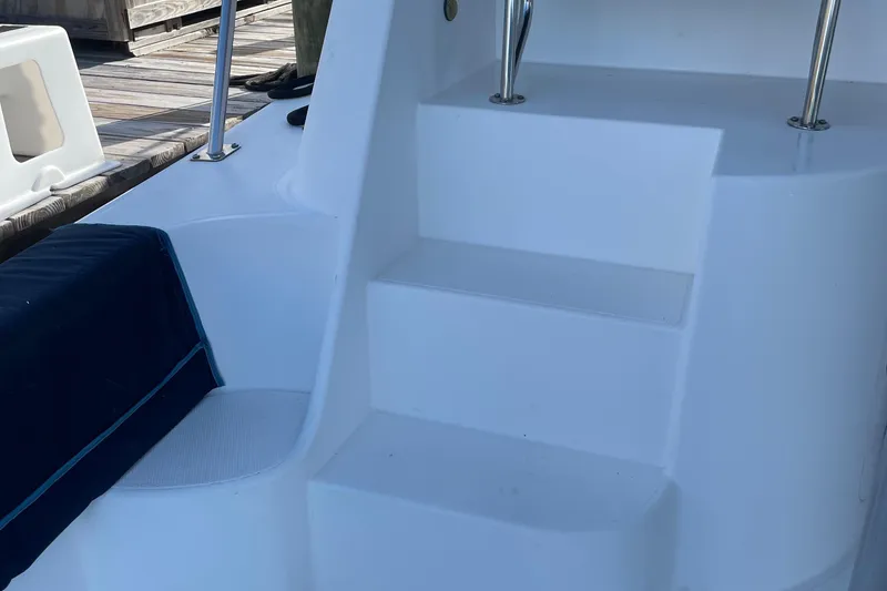 Slide: The Image of Staircase on 2004 Endeavour Explorer 46 PowerCat, leading to upper deck. - 26