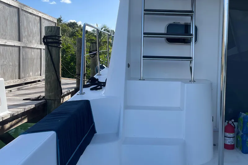Slide: The Image of 2004 Endeavour Explorer 46 PowerCat deck with ladder and dock view. - 27