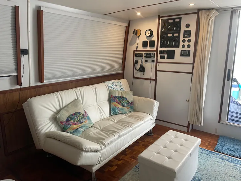 Slide: The Image of Interior of 2004 Endeavour Explorer 46 PowerCat with white sofa and control panel. - 44
