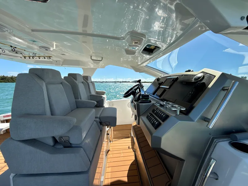 Slide: The Image of 2019 Azimut 40 Verve yacht cockpit with modern helm and plush seating. - 12