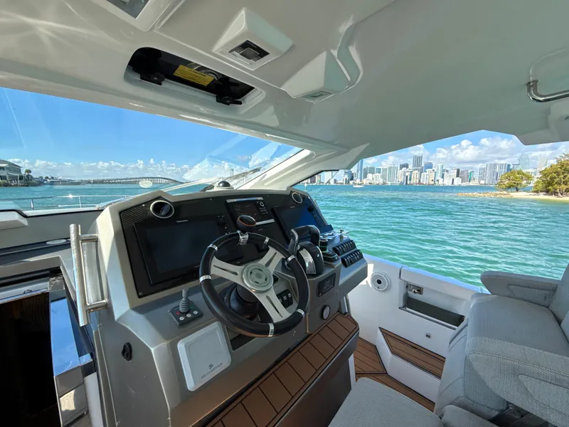 Slide: The Image of 2019 Azimut 40 Verve yacht helm with city skyline and ocean view. - 14