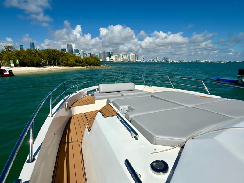 Slide: The Image of Azimut 40 Verve 2019 yacht cruising near a city skyline and beach. - 21