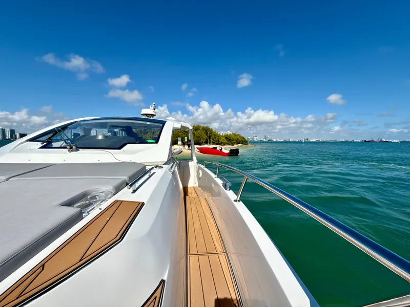 Slide: The Image of 2019 Azimut 40 Verve yacht cruising on clear blue waters under a sunny sky. - 26