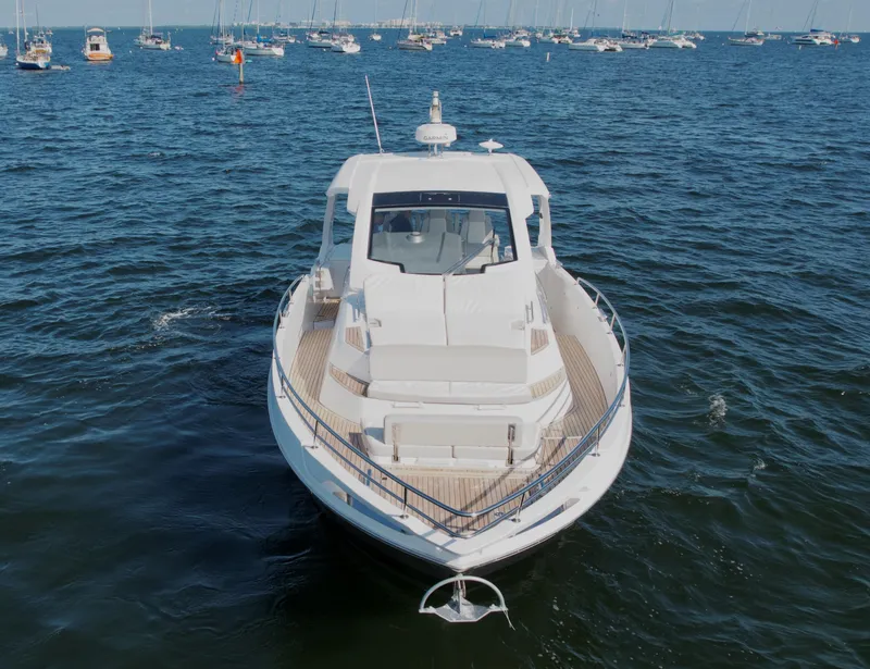 Slide: The Image of Azimut 40 Verve 2019 yacht on open water, front view, surrounded by boats. - 30