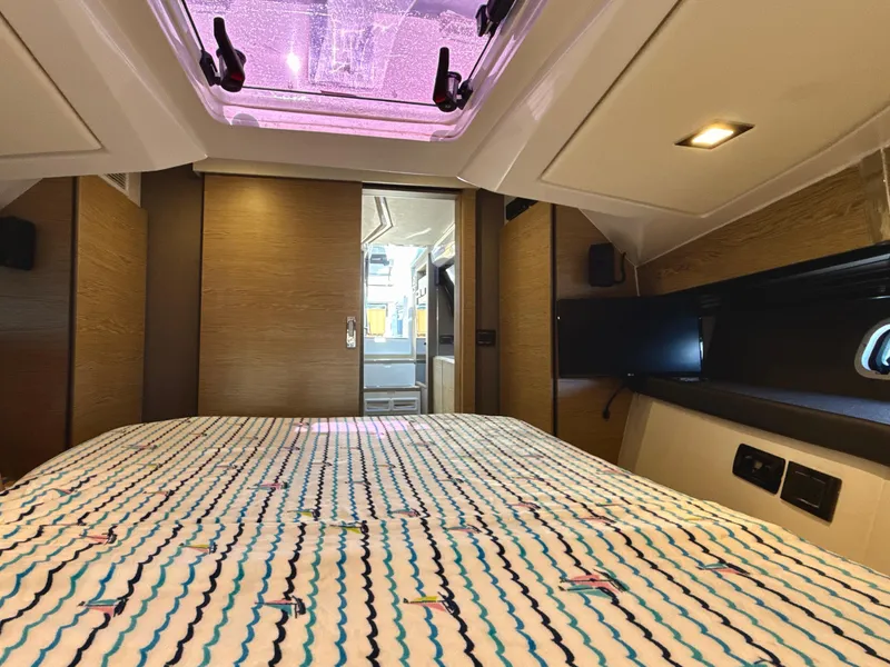 Slide: The Image of Interior cabin of 2019 Azimut 40 Verve yacht with patterned bedding. - 8