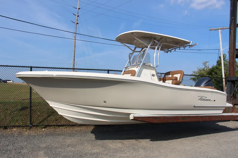 Slide: The Image of 2025 Pioneer 222 Islander boat on display, featuring sleek design and modern amenities. - 8