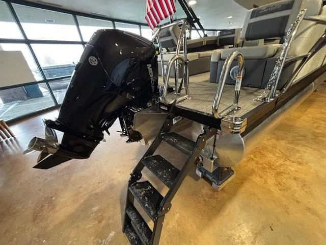 Slide: The Image of 2025 Barletta Cabrio 22M pontoon boat with outboard motor and boarding ladder. - 13