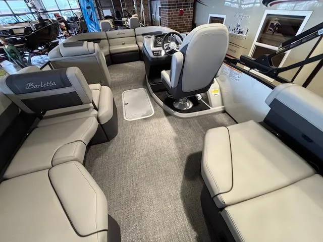 Slide: The Image of 2025 Barletta Cabrio 22M interior with spacious seating and modern helm design. - 17