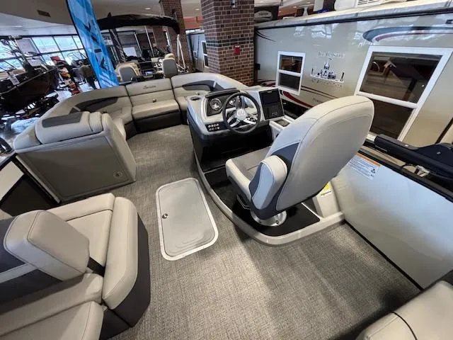 Slide: The Image of 2025 Barletta Cabrio 22M pontoon boat interior with modern seating and helm. - 18